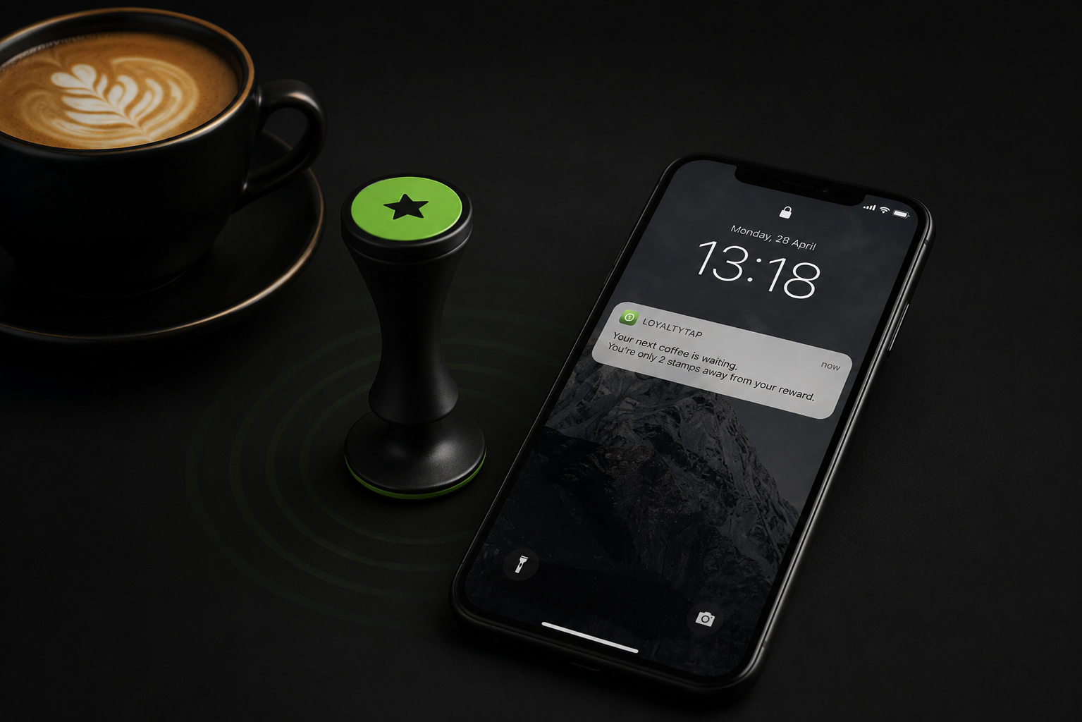 A phone lock screen showing a LoyaltyTap push notification from a café about a free coffee reward